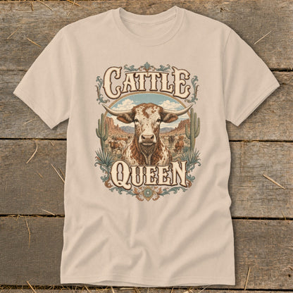 Cream t-shirt with "Cattle Queen" text and a longhorn bull in a desert landscape.