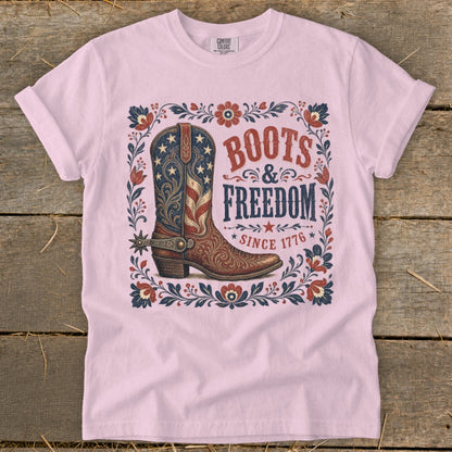 Pink t-shirt with "Boots & Freedom Since 1776" graphic featuring a cowboy boot.