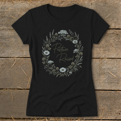 Black t-shirt with floral wreath graphic and "Pasture Raised" text.