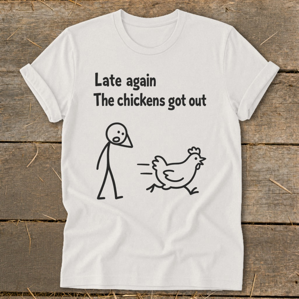 White t-shirt with stick figure and running chicken, text "Late again The chickens got out".