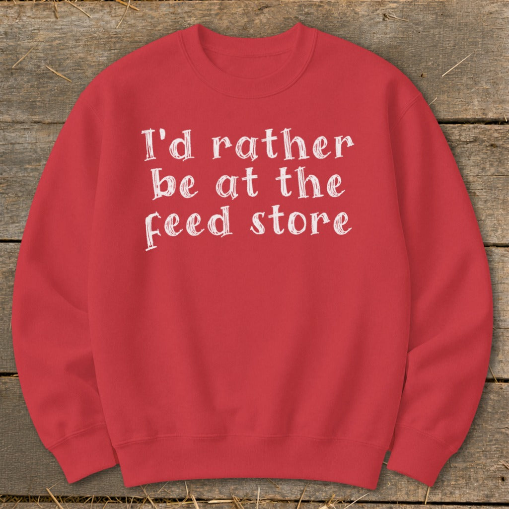 Red sweatshirt with white text "I'd rather be at the feed store".