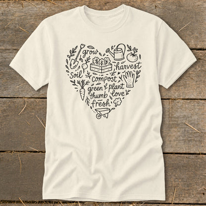 Cream t-shirt with heart-shaped garden illustration and text: grow, soil, compost, green thumb, fresh, harvest, plant, love.