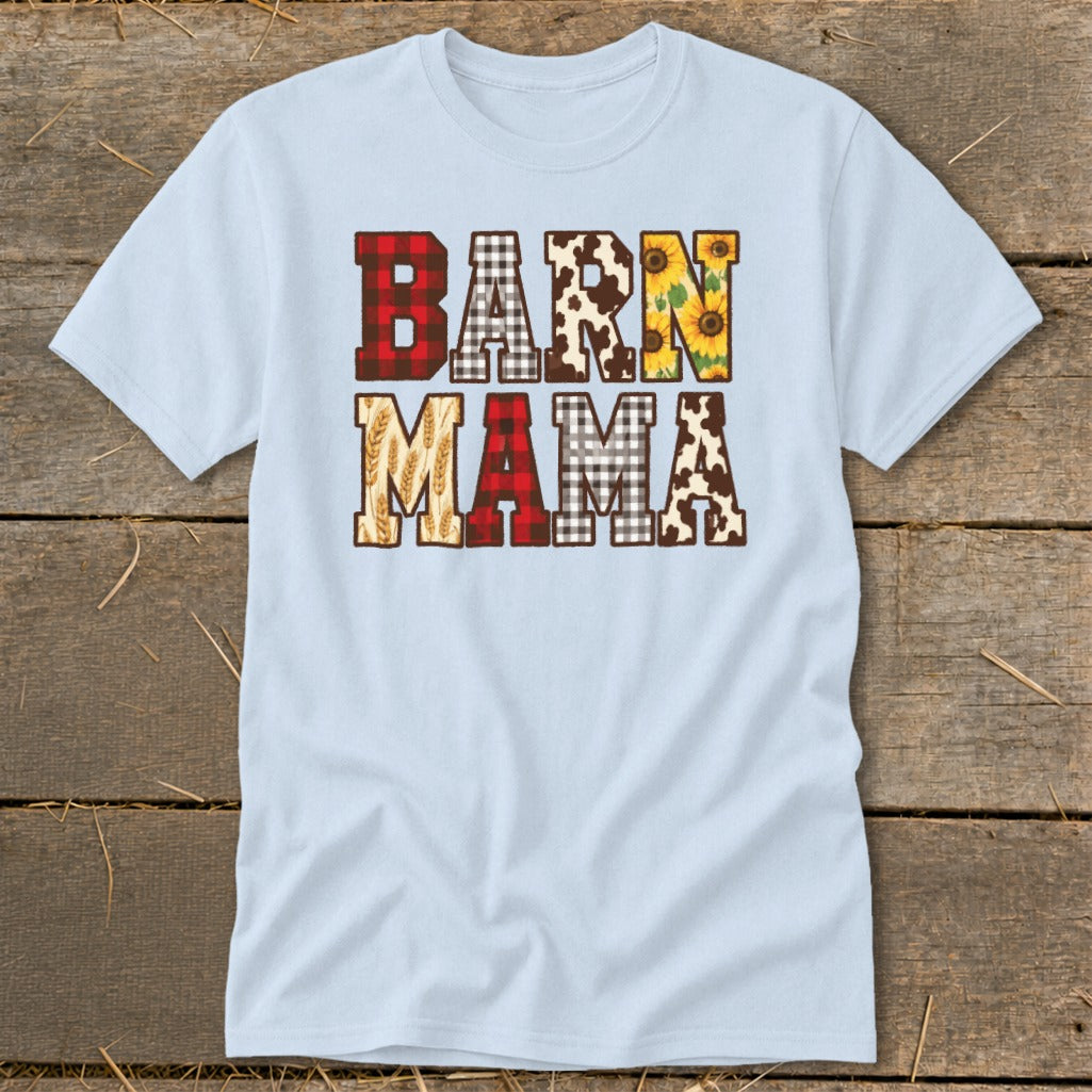 Light blue t-shirt with "BARN MAMA" text featuring plaid, cow print, sunflowers, and wheat.