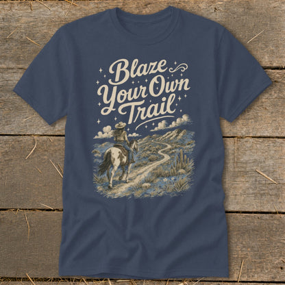 T-shirt with "Blaze Your Own Trail" text and rider on horse in desert landscape.