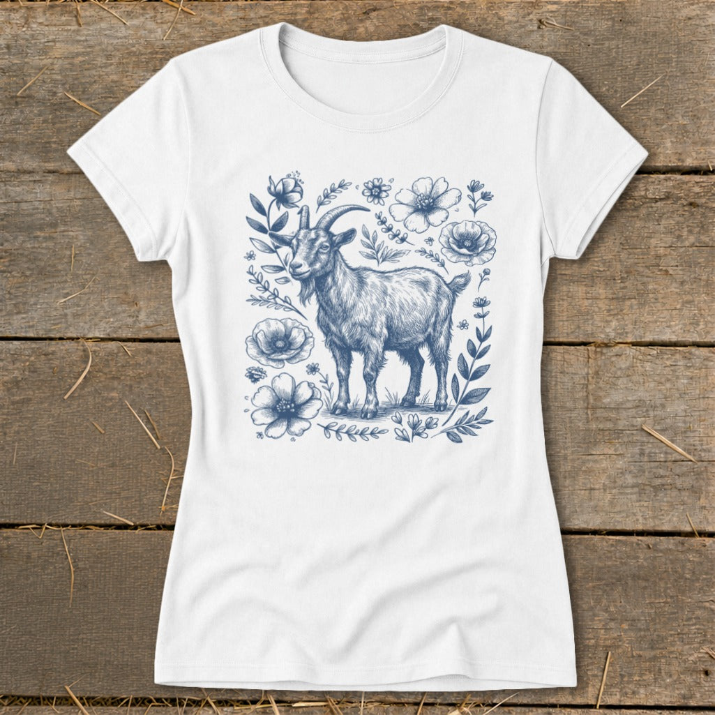 White t-shirt with a blue sketch of a goat surrounded by flowers.