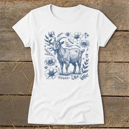 White t-shirt with a blue sketch of a goat surrounded by flowers.