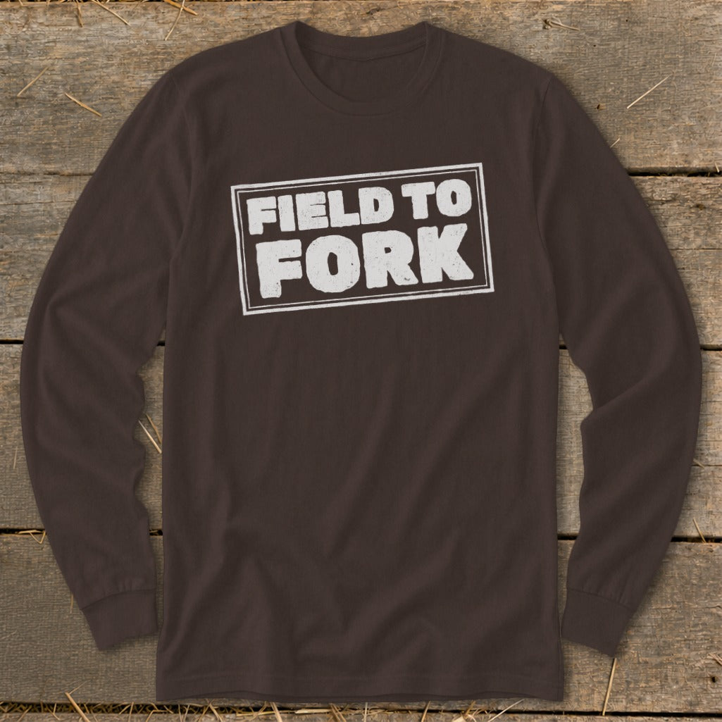 Dark brown long-sleeved t-shirt with a white distressed rectangle graphic reading FIELD TO FORK.