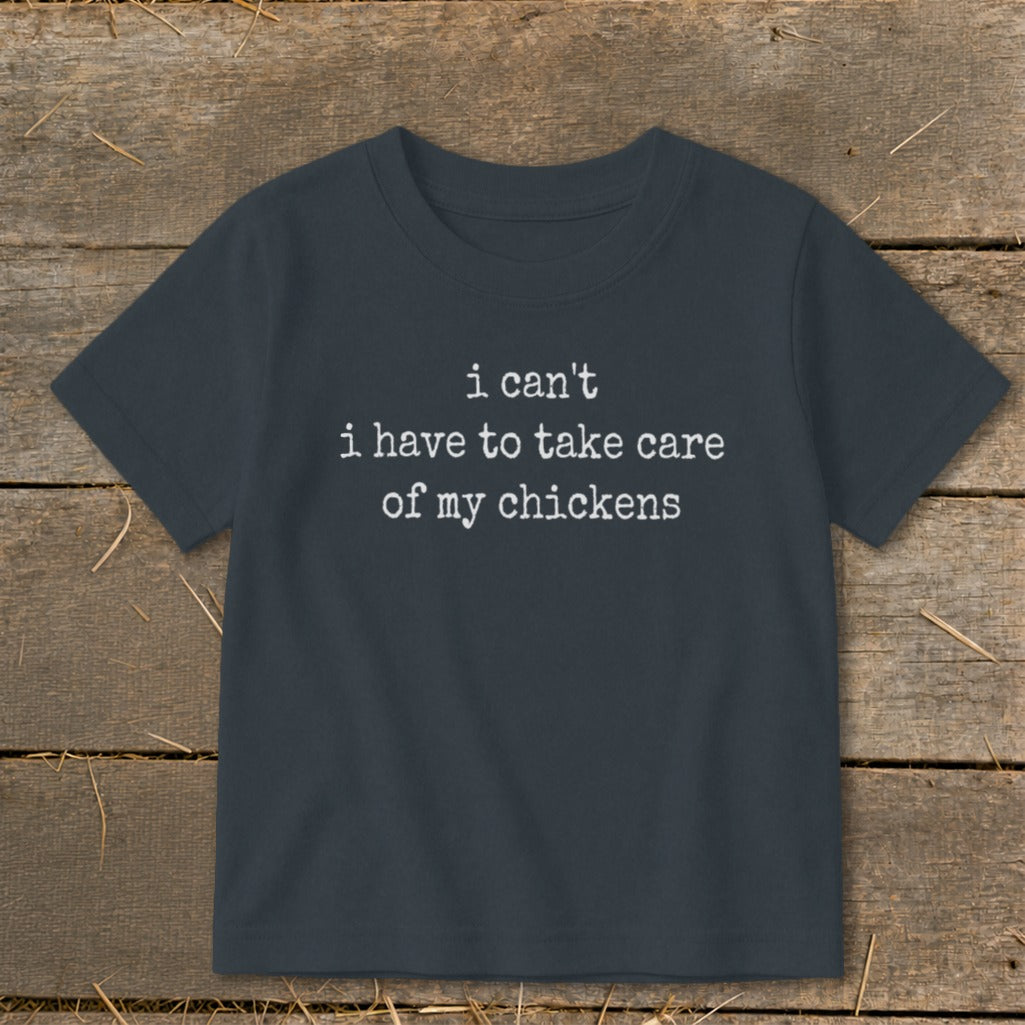 Dark grey t-shirt with white text "i can't i have to take care of my chickens."