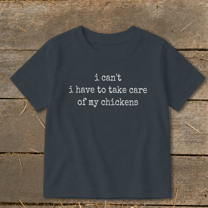 Dark grey t-shirt with white text "i can't i have to take care of my chickens."
