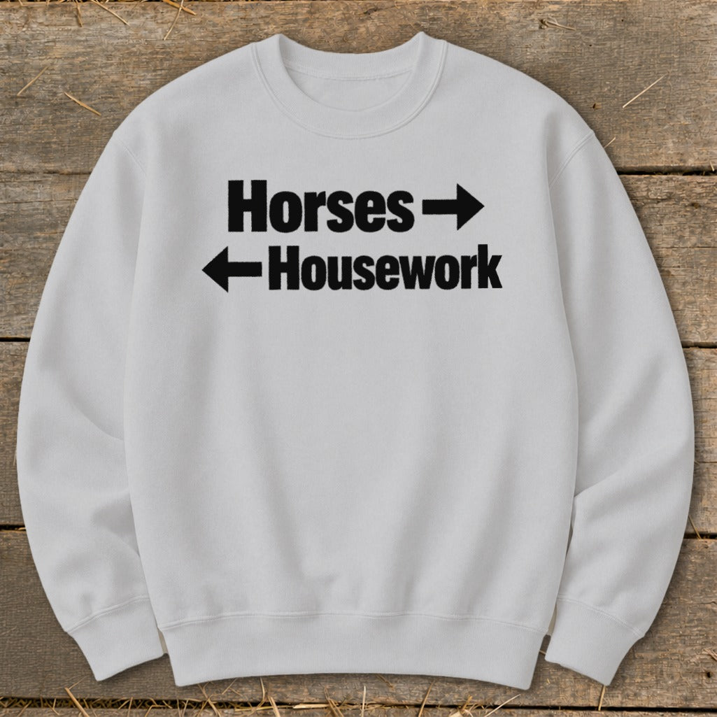 Light gray crewneck sweatshirt printed with the black text Horses right arrow and left arrow Housework.