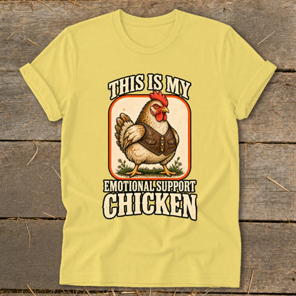 Yellow t-shirt with a chicken wearing a vest and the text "THIS IS MY EMOTIONAL SUPPORT CHICKEN".