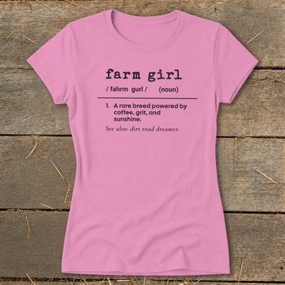 Pink t-shirt with "farm girl" definition: "A rare breed powered by coffee, grit, and sunshine."
