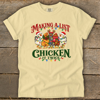 T-shirt with "Making a list Chicken it twice" and five festive chickens.