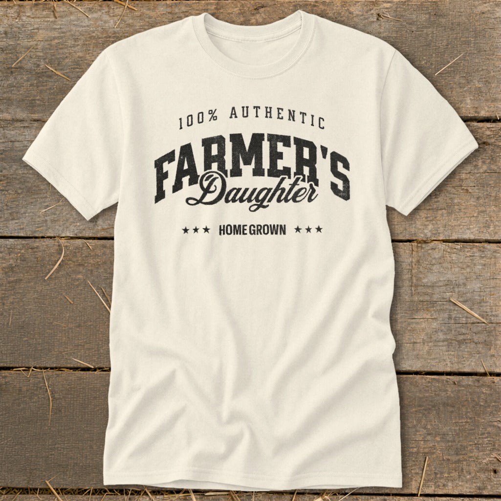 Cream t-shirt with "100% Authentic Farmer's Daughter Home Grown" printed on it.