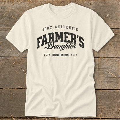 Cream t-shirt with "100% Authentic Farmer's Daughter Home Grown" printed on it.