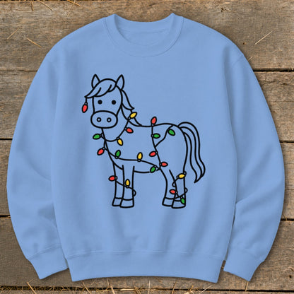 Light blue sweatshirt with a black outline drawing of a horse wrapped in colorful Christmas lights.