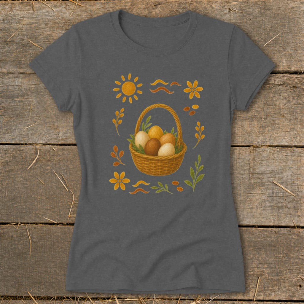 Gray t-shirt featuring a woven basket of Easter eggs and decorative sun, flowers, and leaves.
