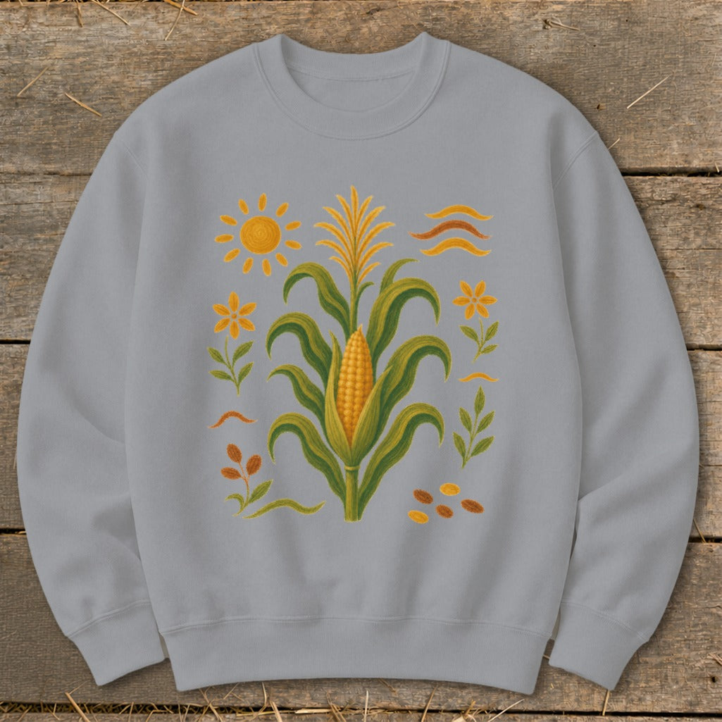 Grey sweatshirt with a stylized corn stalk, sun, flowers, and leaves design.