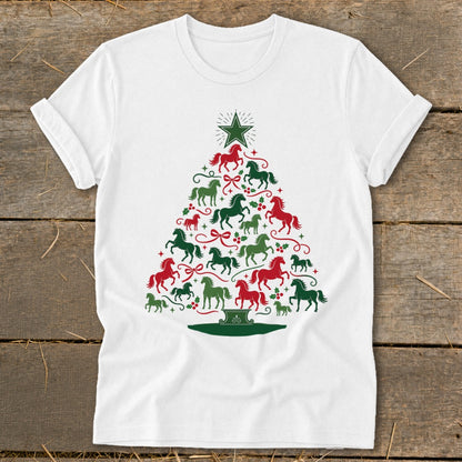 White t-shirt with a Christmas tree made of red and green horses and holly.