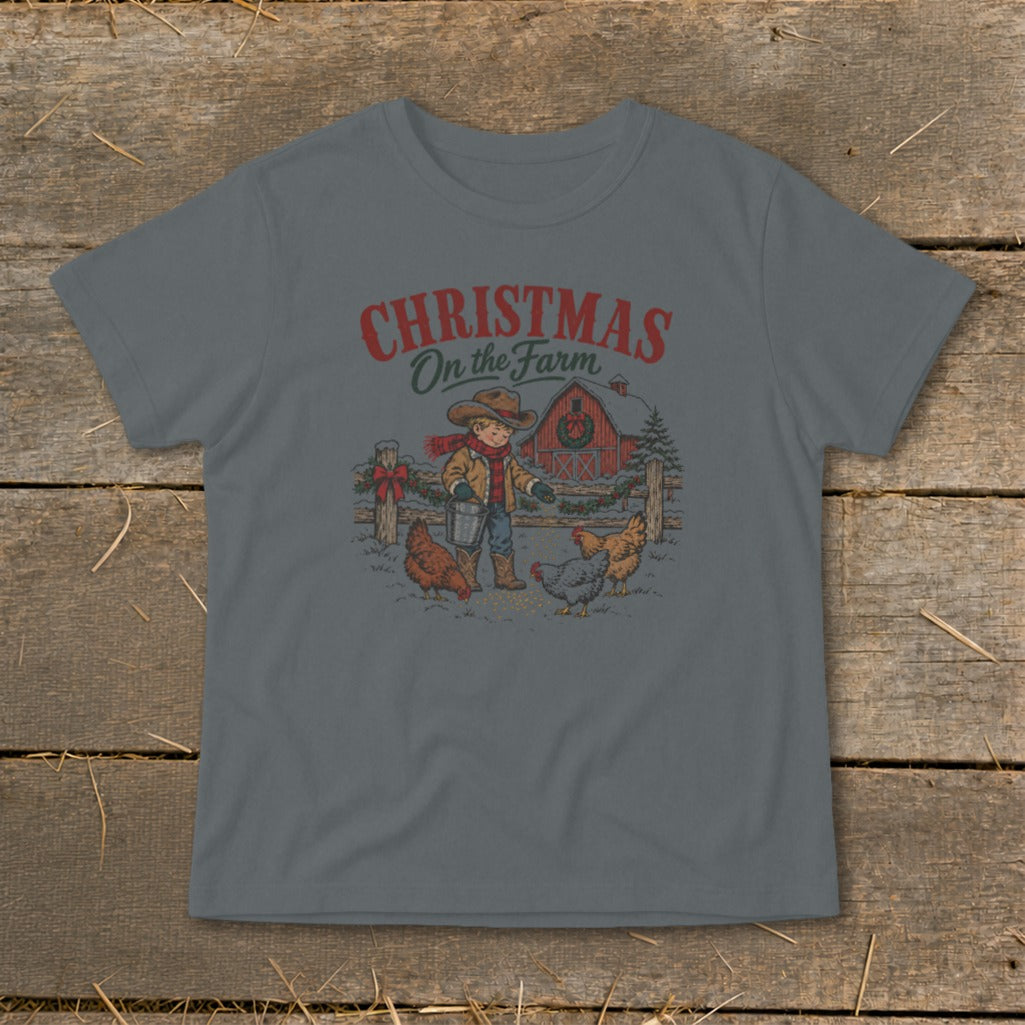 Boy in cowboy hat feeding chickens on a farm with text "Christmas On the Farm".