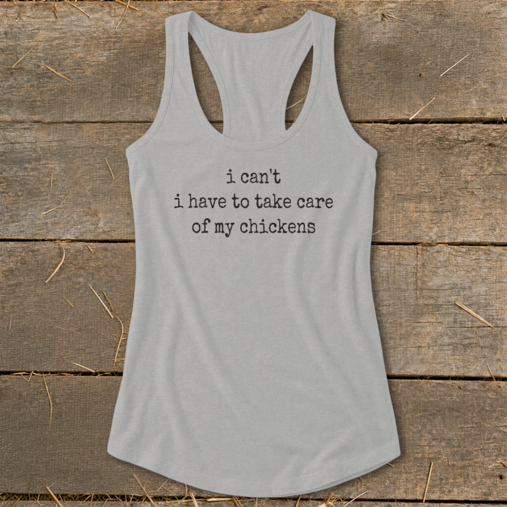 Grey racerback tank top with black text that reads "i can't i have to take care of my chickens".