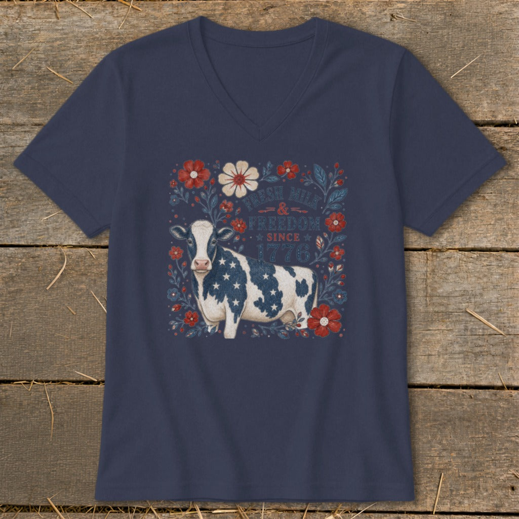 Navy v-neck t-shirt with a cow patterned with the American flag and text.