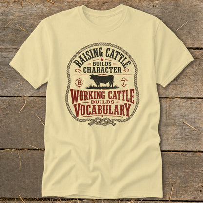 Pale yellow t-shirt with "Raising Cattle Builds Character" and "Working Cattle Builds Vocabulary" text.