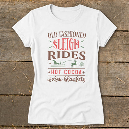 White t-shirt with "Old Fashioned Sleigh Rides Hot Cocoa Warm Blankets" text and graphics.