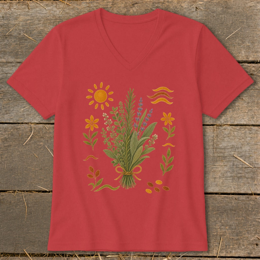 Red V-neck t-shirt with a central bouquet of herbs surrounded by botanical elements and a sun.