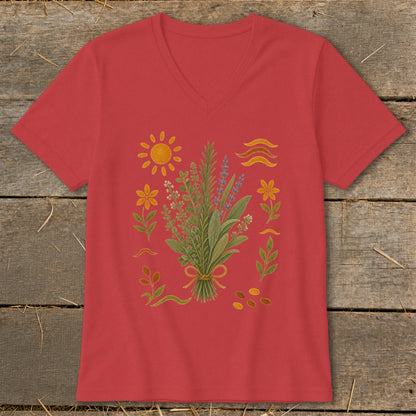 Red V-neck t-shirt with a central bouquet of herbs surrounded by botanical elements and a sun.