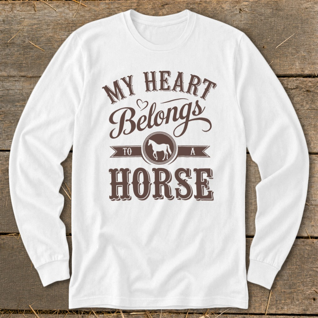 White long-sleeve shirt with "My Heart Belongs To A Horse" text and horse silhouette.