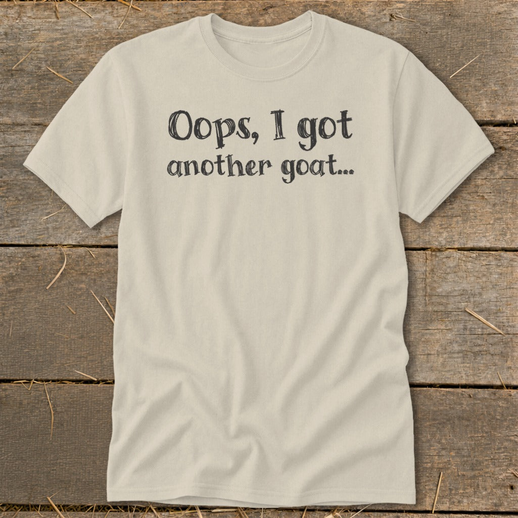 Cream t-shirt with black text "Oops, I got another goat...".