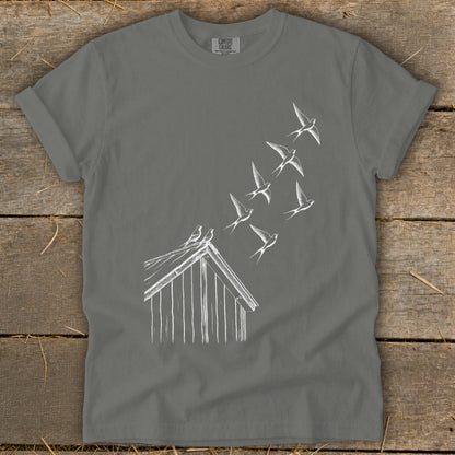 A dark gray crewneck t-shirt featuring a white line drawing of birds flying from a birdhouse roof.