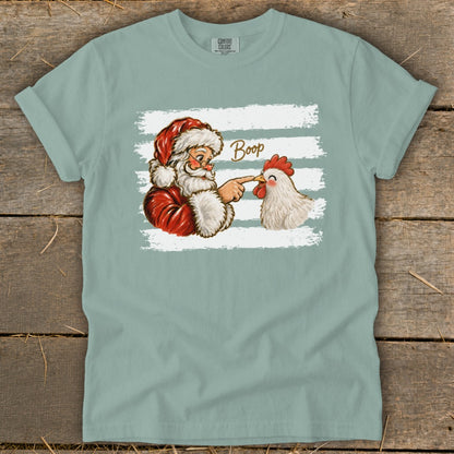 Santa Claus boops a chicken with his finger, text says "Boop".