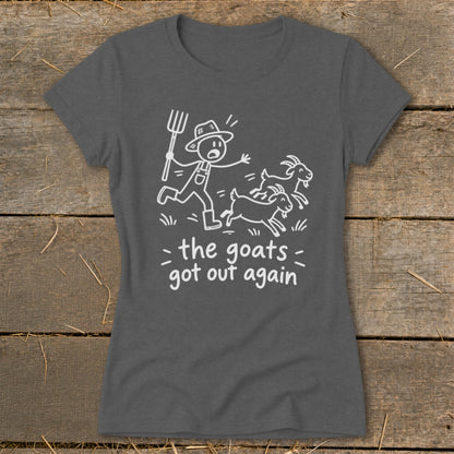 Dark gray t-shirt with a white line drawing of a farmer chasing goats and text reading "the goats got out again".