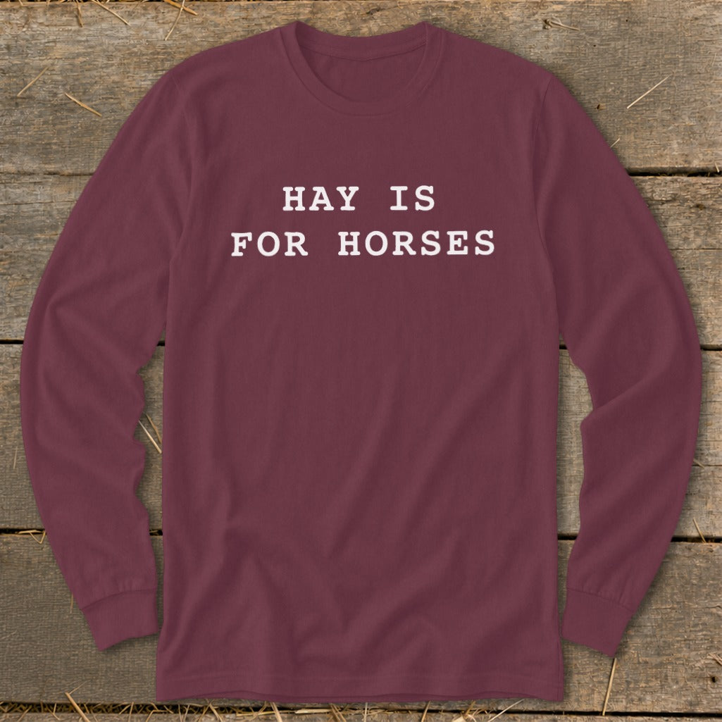 Maroon long-sleeve shirt with white text "HAY IS FOR HORSES."