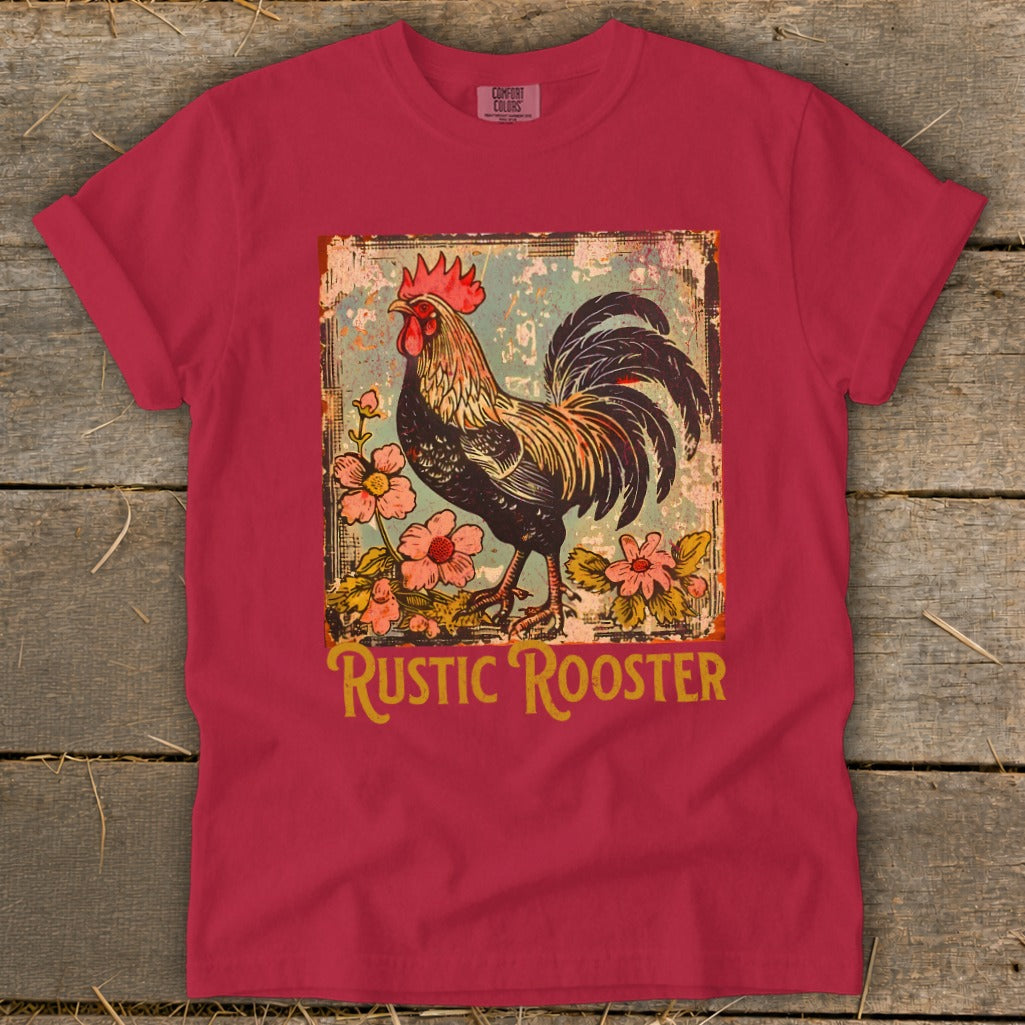 Red t-shirt featuring a distressed graphic of a rooster surrounded by flowers and the text "RUSTIC ROOSTER".