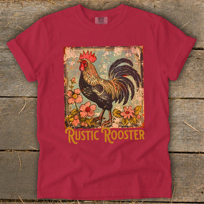 Red t-shirt featuring a distressed graphic of a rooster surrounded by flowers and the text "RUSTIC ROOSTER".