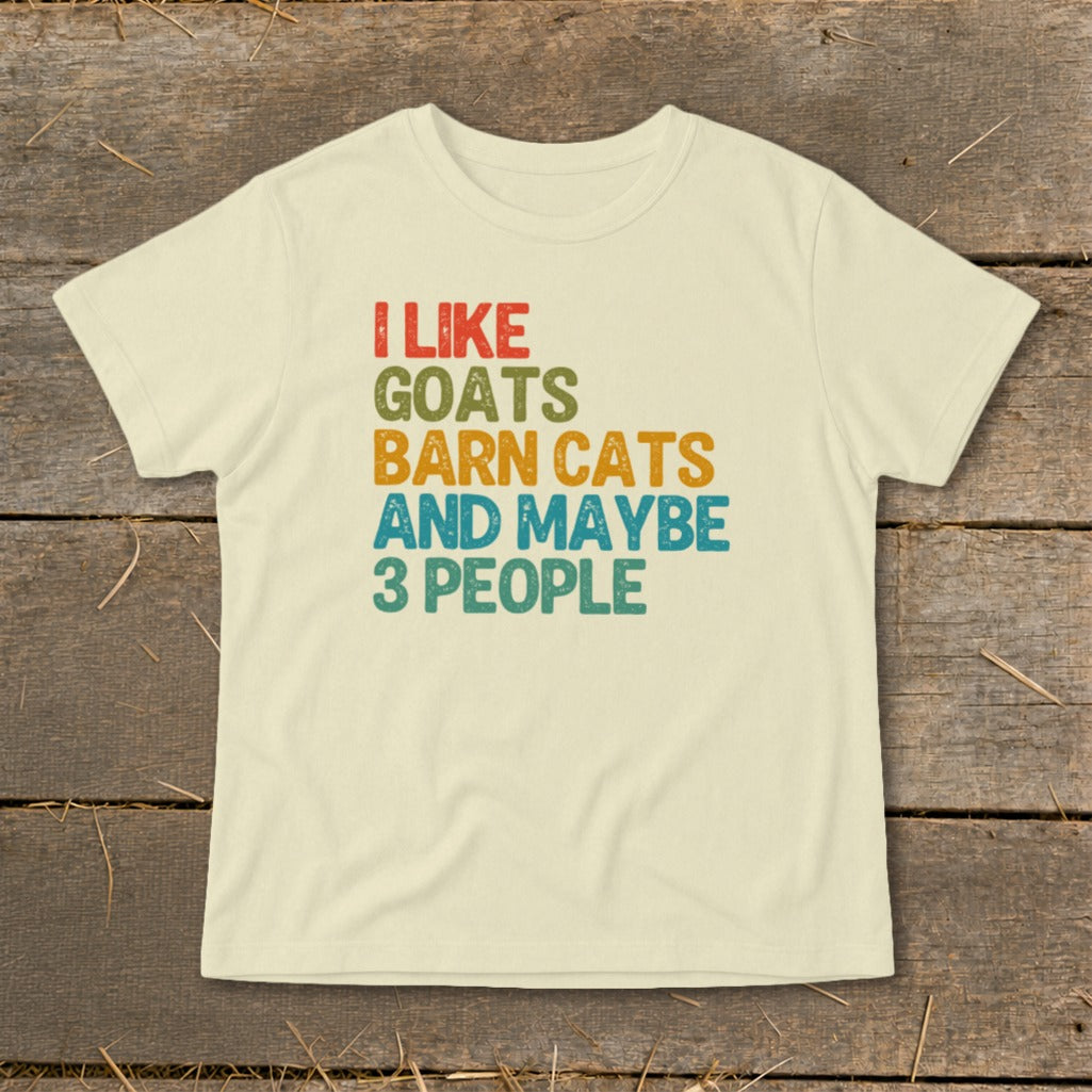 Cream t-shirt with "I like goats, barn cats, and maybe 3 people" text.