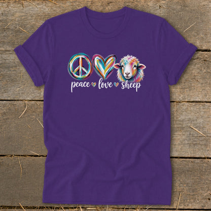 Purple t-shirt with a peace sign, heart, and colorful sheep graphic.