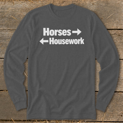 Dark gray long-sleeve t-shirt with white text reading Horses with a right arrow above Housework with a left arrow.