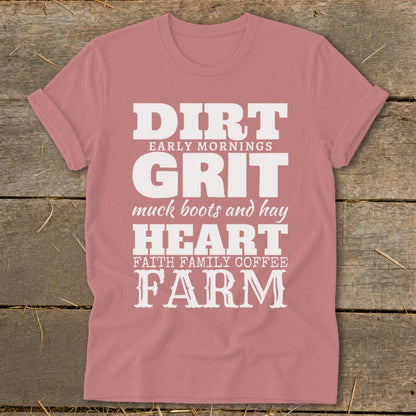 Pink t-shirt with white text: "Dirt, Early Mornings, Grit, Muck Boots and Hay, Heart, Faith Family Coffee, Farm."
