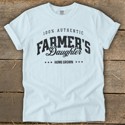 White t-shirt with "100% Authentic Farmer's Daughter Home Grown" text.