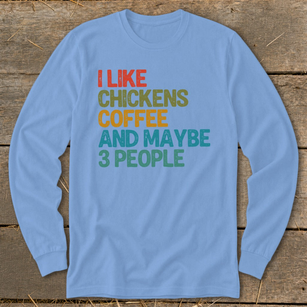 Light blue long-sleeve shirt with text: I like chickens coffee and maybe 3 people.