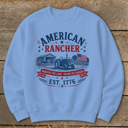Light blue sweatshirt with "American Rancher Est. 1776" graphic.