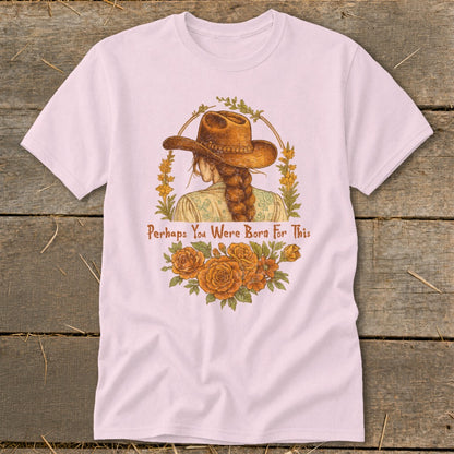Pink t-shirt with distressed artwork of a woman in a cowboy hat with flowers and text.