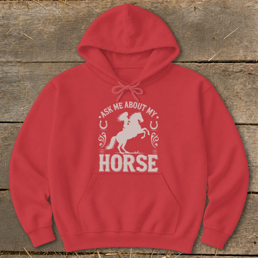 Red hoodie with a white graphic of a woman riding a horse and the text "Ask Me About My Horse."