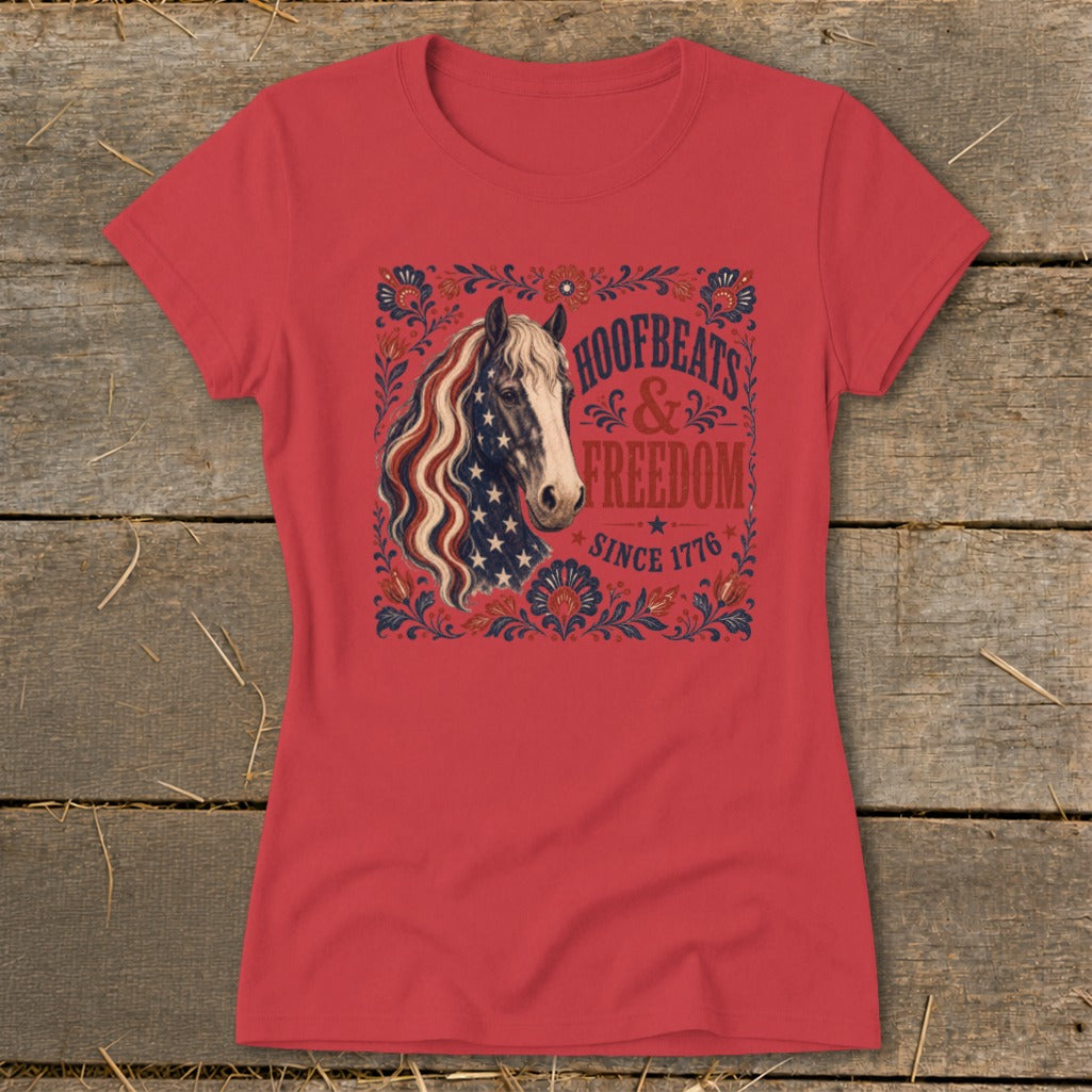 Red t-shirt with a horse head graphic featuring American flag colors and the text "Hoofbeats & Freedom Since 1776".