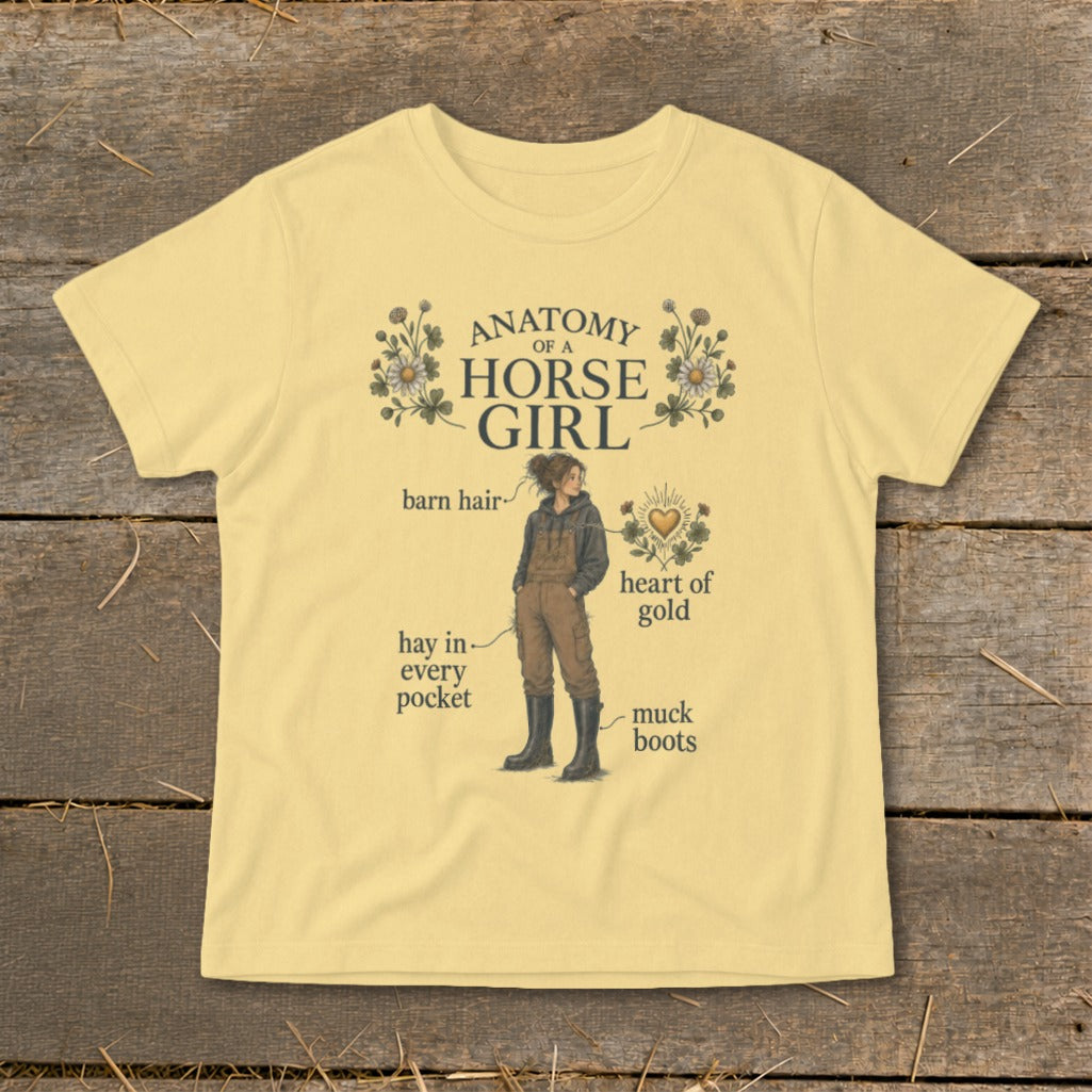 Yellow t-shirt with "Anatomy of a Horse Girl" graphic, showing a girl with barn hair, hay, and muck boots.
