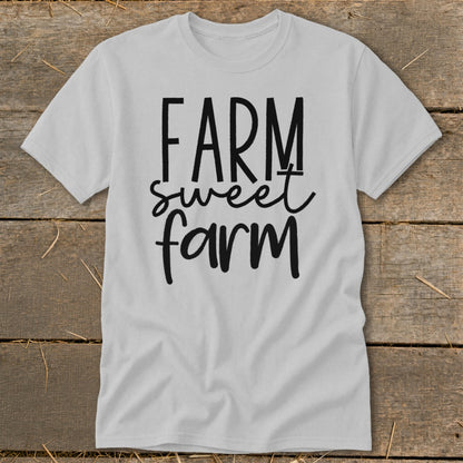 White t-shirt with "Farm sweet farm" text in black lettering.